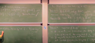 A blurry photo of a blackboard containing mathematics