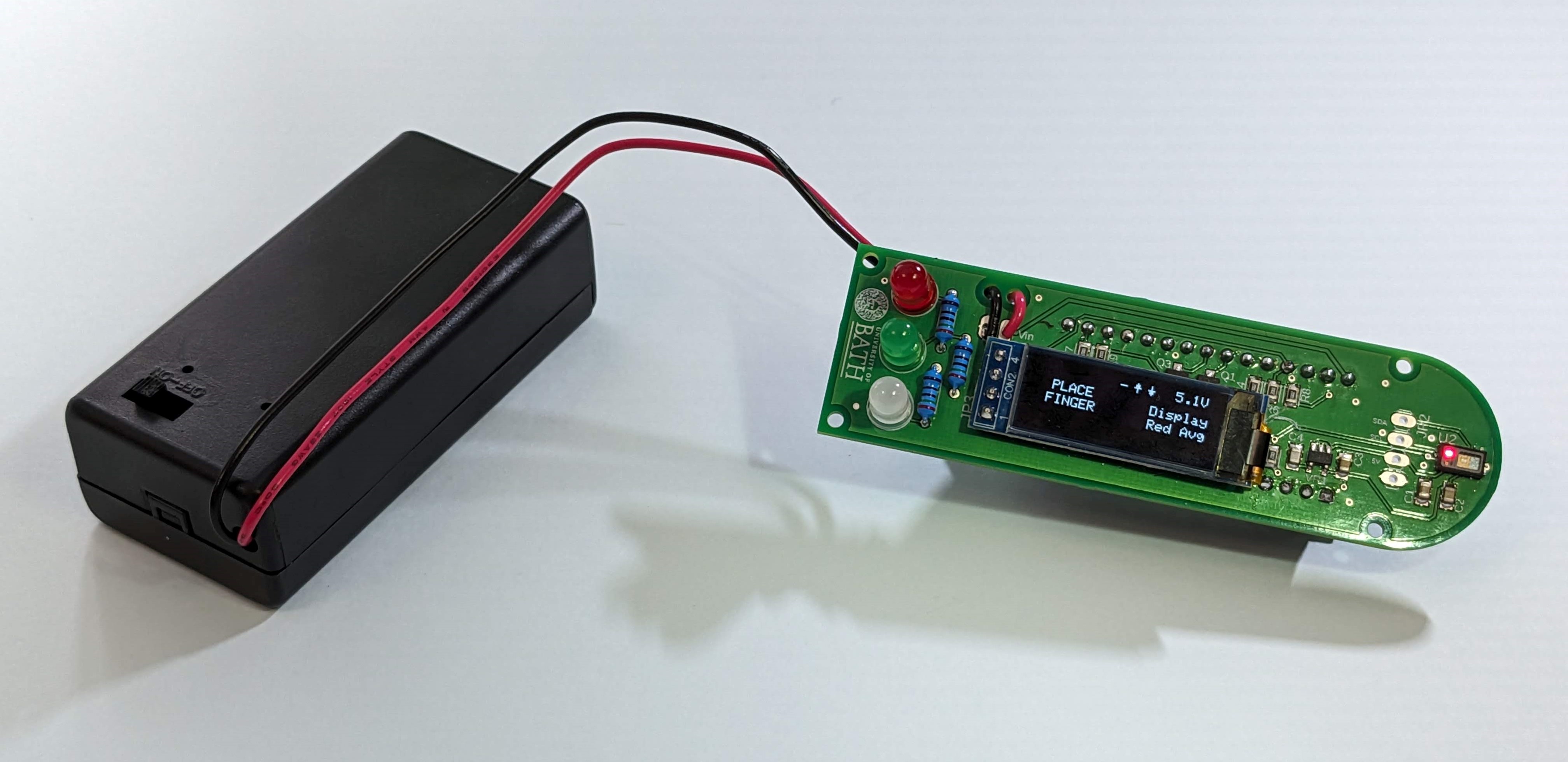 The completed circuit board, with the battery box attached via the stress-relief holes to avoid repetitive motion breaking the solder joints.